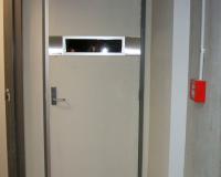 Fire rated door with horizontal vision panel