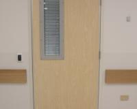 Formica faced hospital door set with vision panel and venetian blinds.