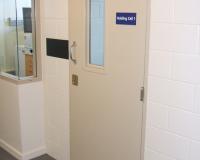 Custodial door set with secure vision panel